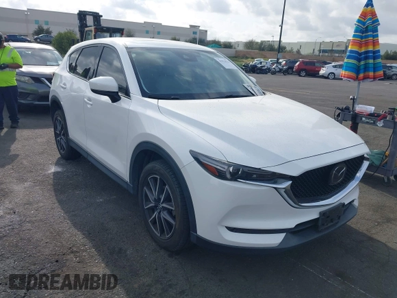 2018 Mazda CX-5 Grand Touring with VIN JM3KFADMXJ0470846, listed as a IAAI auction lot 41913533 with 54,700 mi miles and . Bid and sale history available at DreamBid. Image 1.