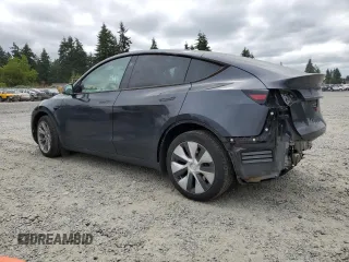 2024 Tesla Model Y Long Range with VIN 7SAYGDEE9RF069801, listed as a Copart auction lot 60857145 with 18,808 mi miles and Salvage title. Bid and sale history available at DreamBid. Image 2.
