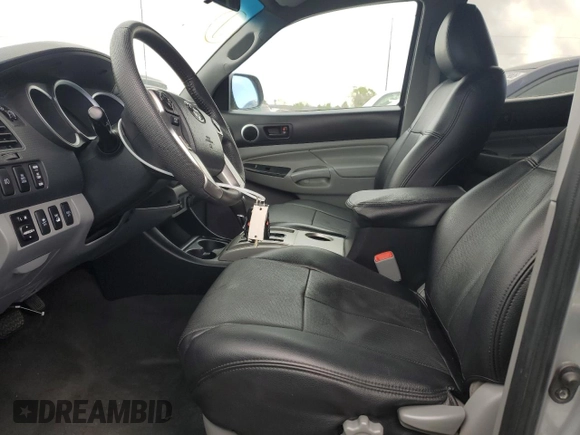 2015 Toyota Tacoma with VIN 3TMLU4EN4FM168078, listed as a Copart auction lot 54689785 with 103,716 mi miles and Salvage Title. Bid and sale history available at DreamBid. Image 7.