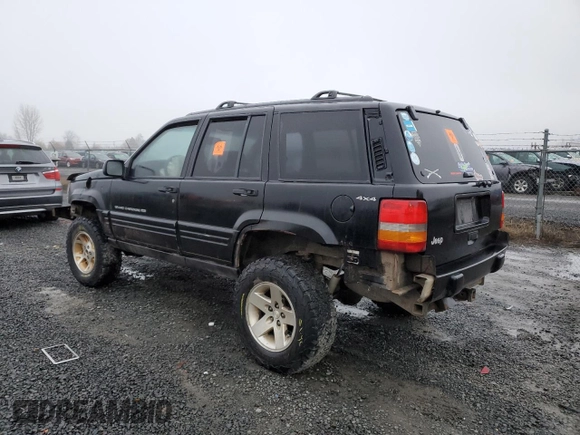 1998 Jeep Grand Cherokee Laredo with VIN 1J4GZ48S0WC171138, listed as a Copart auction lot 85502794 with 0 mi miles and Salvage Title. Bid and sale history available at carsss.com. Image 2.