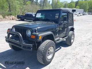 2002 Jeep Wrangler Sport with VIN 1J4FA49S52P700846, listed as a IAAI auction lot 42052276 with 231,851 mi miles. Bid and sale history available at carsss.com. Image 2.