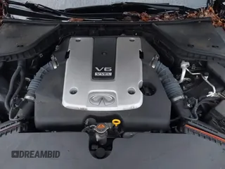 2015 Infiniti Q50 Premium z VIN JN1BV7ARXFM412382, wystawiony jako IAAI lot #40776813 z przebiegiem 66 406 mil mil oraz . Historia ofert i sprzedaży dostępna na DreamBid. Obrazek 10.