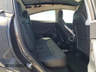 2024 Tesla Model Y Long Range z VIN 7SAYGDEE6RF032348, wystawiony jako Copart lot #58158355 z przebiegiem Nie podano mil oraz Szkoda całkowita • Salvage title. Historia ofert i sprzedaży dostępna na DreamBid. Obrazek 11.