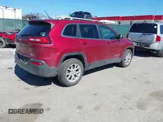 2015 Jeep Cherokee Latitude with VIN 1C4PJMCB6FW714656, listed as a IAAI auction lot 41887261 with 131,600 mi miles and . Bid and sale history available at carsss.com. Image 4.