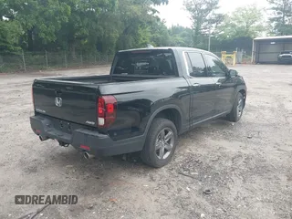 2023 Honda Ridgeline RTL-E with VIN 5FPYK3F77PB052828, listed as a IAAI auction lot 42366947 with 24,658 mi miles and . Bid and sale history available at DreamBid. Image 4.