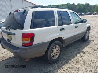 2003 Jeep Grand Cherokee Laredo z VIN 1J4GX48S33C519404, wystawiony jako IAAI lot #42164364 z przebiegiem 174 627 mil mil oraz . Historia ofert i sprzedaży dostępna na DreamBid. Obrazek 4.