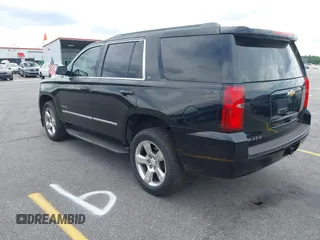 2015 Chevrolet Tahoe LT with VIN 1GNSCBKC4FR145119, listed as a IAAI auction lot 42309931 with 99,408 mi miles and . Bid and sale history available at DreamBid. Image 3.
