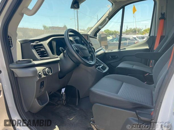 2023 Ford Transit Cargo with VIN 1FTBR1X87PKB99515, listed as a IAAI auction lot 42821393 with 10,442 mi miles and . Bid and sale history available at DreamBid. Image 3.