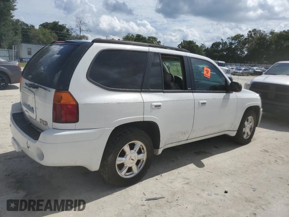 2005 GMC Envoy SLT with VIN 1GKDT13S052311455, listed as a Copart auction lot 73635434 with Not Provided miles and Salvage Title. Bid and sale history available at DreamBid. Image 3.