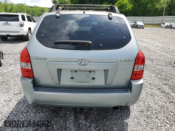 2005 Hyundai Tucson GL with VIN KM8JM12B05U148660, listed as a Copart auction lot 54302805 with 257,233 mi miles and Salvage title. Bid and sale history available at DreamBid. Image 6.