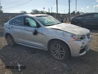 2017 BMW X4 M40i with VIN 5UXXW7C51H0U25511, listed as a Copart auction lot 77492894 with 94,003 mi miles and Salvage Title. Bid and sale history available at carsss.com. Image 4.