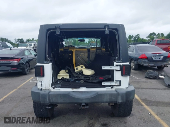 2018 Jeep Wrangler Unlimited Sport S with VIN 1C4BJWDG6JL818719, listed as a IAAI auction lot 42412991 with 58,399 mi miles and . Bid and sale history available at DreamBid. Image 16.