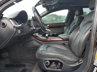 2014 Audi A8 3.0T z VIN WAURGAFD2EN002567, wystawiony jako Copart lot #48188395 z przebiegiem 159 477 mil mil oraz Szkody całkowita. Historia ofert i sprzedaży dostępna na DreamBid. Obrazek 7.