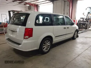 2014 Dodge Grand Caravan American Value with VIN 2C4RDGBG7ER345277, listed as a IAAI auction lot 42061355 with 145,889 mi miles and . Bid and sale history available at DreamBid. Image 4.