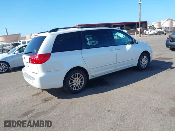 2010 Toyota Sienna XLE with VIN 5TDYK4CC3AS336590, listed as a IAAI auction lot 41798194 with 230,707 mi miles. Bid and sale history available at carsss.com. Image 4.