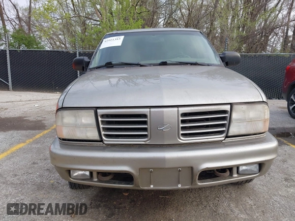 2001 Oldsmobile Bravada z VIN 1GHDT13WX12110603, wystawiony jako IAAI lot #41911383 z przebiegiem 164 916 mil mil oraz . Historia ofert i sprzedaży dostępna na DreamBid. Obrazek 6.
