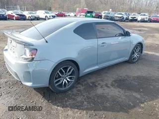 2014 Scion tC z VIN JTKJF5C71E3081033, wystawiony jako IAAI lot #41928949 z przebiegiem 144 112 mil mil oraz . Historia ofert i sprzedaży dostępna na DreamBid. Obrazek 4.