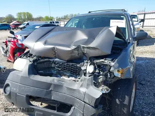 2006 Ford Escape XLT with VIN 1FMYU03106KA54774, listed as a IAAI auction lot 41940956 with 146,674 mi miles. Bid and sale history available at carsss.com. Image 6.