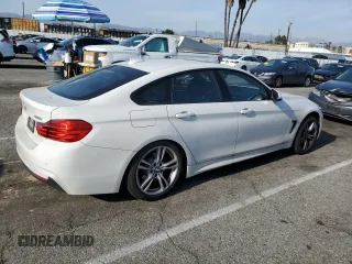 2015 BMW 4 Series 428i with VIN WBA4A9C59FGL87249, listed as a Copart auction lot 52182775 with 57,797 mi miles and Salvage title. Bid and sale history available at DreamBid. Image 3.