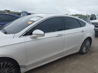 2016 Ford Fusion Titanium with VIN 3FA6P0K96GR103571, listed as a IAAI auction lot 42340764 with 180,870 mi miles and . Bid and sale history available at DreamBid. Image 14.