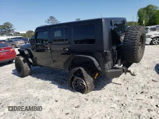 2013 Jeep Wrangler Unlimited Moab with VIN 1C4HJWEG7DL600043, listed as a Copart auction lot 52146945 with 118,882 mi miles and Salvage title. Bid and sale history available at DreamBid. Image 2.