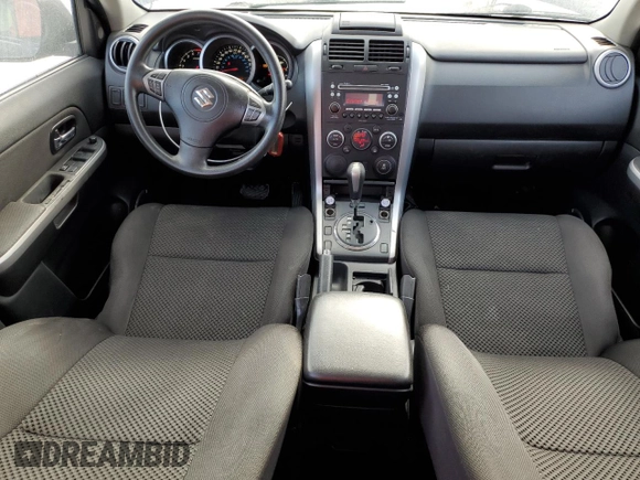 2012 Suzuki Grand Vitara Premium z VIN JS3TD0D29C4100139, wystawiony jako Copart lot #49163115 z przebiegiem 271 080 mil mil oraz Nie do naprawy. Historia ofert i sprzedaży dostępna na DreamBid. Obrazek 8.