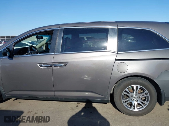 2011 Honda Odyssey EX-L with VIN 5FNRL5H6XBB083980, listed as a IAAI auction lot 42100308 with 191,361 mi miles and . Bid and sale history available at carsss.com. Image 14.