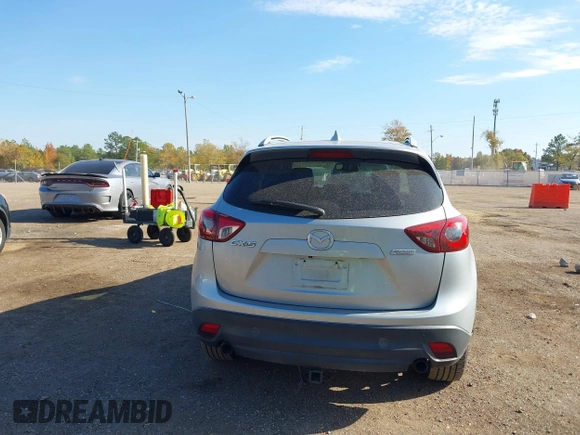 2016 Mazda CX-5 Grand Touring z VIN JM3KE2DY3G0712249, wystawiony jako IAAI lot #37910910 z przebiegiem 262 058 mil mil oraz . Historia ofert i sprzedaży dostępna na DreamBid. Obrazek 16.