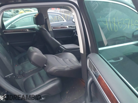 2012 Volkswagen Touareg Sport with VIN WVGFK9BP7CD002243, listed as a IAAI auction lot 41863765 with 136,231 mi miles and . Bid and sale history available at DreamBid. Image 8.