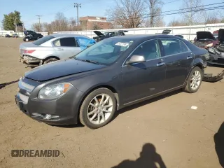 2012 Chevrolet Malibu LTZ with VIN 1G1ZG5E76CF249581, listed as a Copart auction lot 49241595 with 123,864 mi miles and Salvage Title. Bid and sale history available at DreamBid. Image 1.
