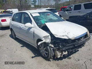 2006 Kia Spectra with VIN KNAFE162765318099, listed as a IAAI auction lot 41890796 with 241,431 mi miles. Bid and sale history available at carsss.com. Image 1.