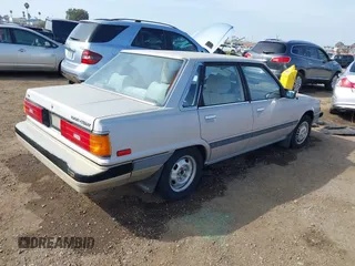 1985 Toyota Camry z VIN JT2SV16E9F0351378, wystawiony jako IAAI lot #41605627 z przebiegiem 192 476 mil mil oraz . Historia ofert i sprzedaży dostępna na DreamBid. Obrazek 4.