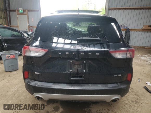 2021 Ford Escape SEL с VIN 1FMCU9H61MUA41424, выставлен на аукционе Copart как лот 57634055 с пробегом 145 286 миль миль и Списание • Salvage title. История ставок и продаж доступна на DreamBid. Изображение 6.