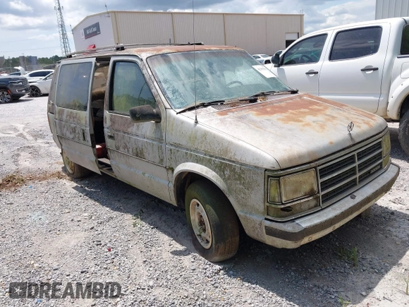 1987 Dodge Caravan z VIN 2B4FK41G3HR127301, wystawiony jako IAAI lot #42393563 z przebiegiem Nie podano mil oraz . Historia ofert i sprzedaży dostępna na DreamBid. Obrazek 1.