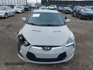 2013 Hyundai Veloster w/Gray Int z VIN KMHTC6AD3DU140949, wystawiony jako IAAI lot #41883011 z przebiegiem 108 247 mil mil oraz . Historia ofert i sprzedaży dostępna na DreamBid. Obrazek 12.