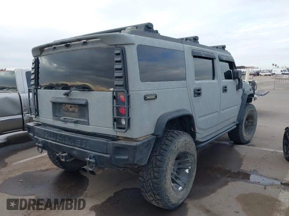 2003 Hummer H2 with VIN 5GRGN23U13H128617, listed as a IAAI auction lot 41494349 with 135,295 mi miles. Bid and sale history available at carsss.com. Image 4.
