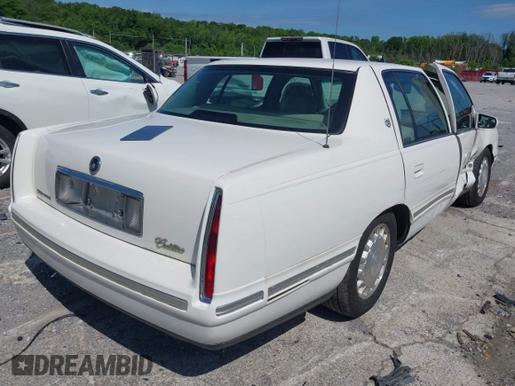 1999 Cadillac DeVille z VIN 1G6KD54Y3XU712969, wystawiony jako IAAI lot #42344041 z przebiegiem 169 572 mil mil oraz . Historia ofert i sprzedaży dostępna na DreamBid. Obrazek 4.