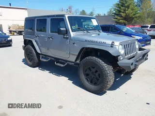 2014 Jeep Wrangler Unlimited Rubicon with VIN 1C4BJWFG7EL327045, listed as a IAAI auction lot 42146333 with 115,596 mi miles. Bid and sale history available at carsss.com. Image 1.