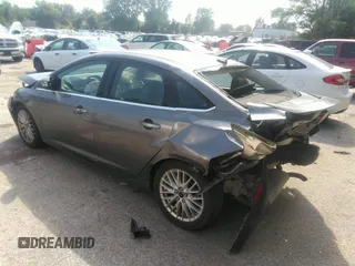 2014 Ford Focus Titanium with VIN 1FADP3J20EL236805, listed as a IAAI auction lot 41708437 with 105,724 mi miles. Bid and sale history available at carsss.com. Image 3.