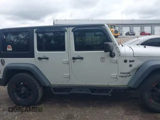 2014 Jeep Wrangler Unlimited Sport with VIN 1C4BJWDG9EL135077, listed as a IAAI auction lot 42324775 with 104,221 mi miles and . Bid and sale history available at DreamBid. Image 13.