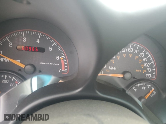 2001 Pontiac Grand Am with VIN 1G2NE12TX1M668035, listed as a Copart auction lot 59700585 with 60,965 mi miles and Salvage title. Bid and sale history available at DreamBid. Image 9.