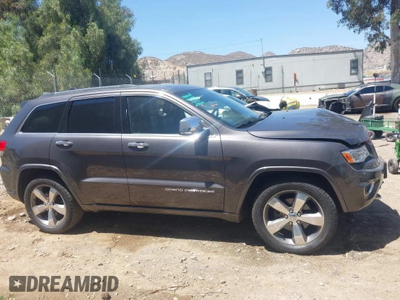 2015 Jeep Grand Cherokee Overland with VIN 1C4RJFCG7FC839778, listed as a IAAI auction lot 42490111 with 160,040 mi miles and . Bid and sale history available at DreamBid. Image 14.