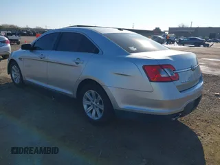 2011 Ford Taurus SE with VIN 1FAHP2DWXBG172965, listed as a IAAI auction lot 41395638 with 147,098 mi miles. Bid and sale history available at carsss.com. Image 3.