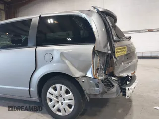 2019 Dodge Grand Caravan SE with VIN 2C4RDGBG3KR571537, listed as a IAAI auction lot 42036875 with 95,190 mi miles and . Bid and sale history available at DreamBid. Image 6.