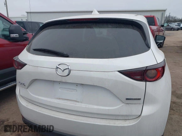 2021 Mazda CX-5 Touring with VIN JM3KFACM0M0412718, listed as a IAAI auction lot 41486753 with 41,496 mi miles. Bid and sale history available at carsss.com. Image 16.