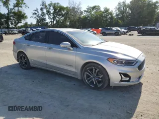 2019 Ford Fusion Titanium with VIN 3FA6P0RU1KR209297, listed as a Copart auction lot 54358065 with 122,600 mi miles and Salvage Title. Bid and sale history available at DreamBid. Image 4.