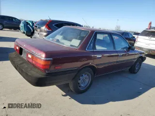 1990 Toyota Camry z VIN JT2SV21E7L3411990, wystawiony jako Copart lot #88557555 z przebiegiem 335 803 mil mil oraz Szkoda całkowita • Salvage title. Historia ofert i sprzedaży dostępna na DreamBid. Obrazek 3.