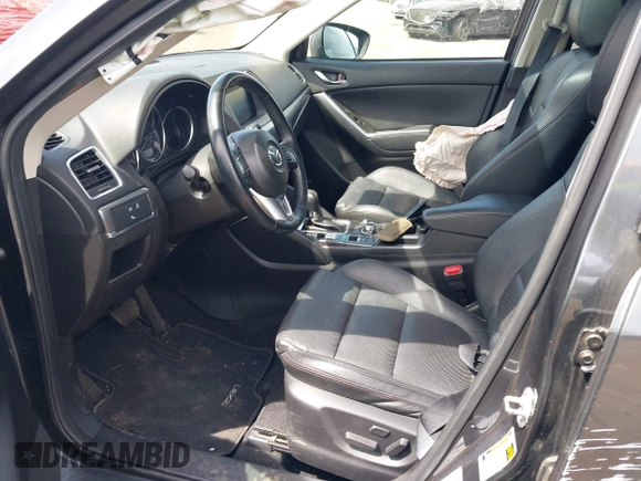 2016 Mazda CX-5 Grand Touring z VIN JM3KE4DY1G0893119, wystawiony jako IAAI lot #42049614 z przebiegiem 102 506 mil mil oraz . Historia ofert i sprzedaży dostępna na DreamBid. Obrazek 5.