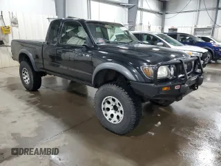 2004 Toyota Tacoma with VIN 5TEWN72N14Z424211, listed as a Copart auction lot 51815615 with 203,415 mi miles and Salvage Title. Bid and sale history available at DreamBid. Image 4.
