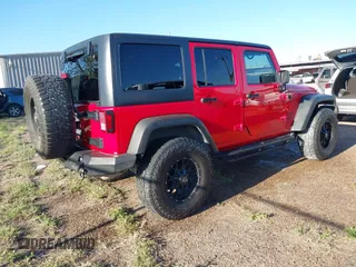 2015 Jeep Wrangler Unlimited Willys Wheeler with VIN 1C4BJWDG0FL635341, listed as a IAAI auction lot 41955393 with 145,529 mi miles and . Bid and sale history available at DreamBid. Image 4.